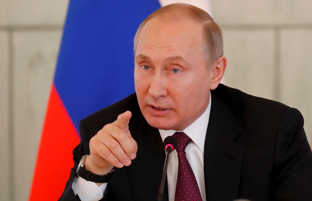 Russian President Vladimir Putin gestures while speaking to employees of the Almazov National Medical Center in St.Petersburg, Russia, Friday, March 16, 2018. (Anatoly Maltsev/Pool Photo via AP)