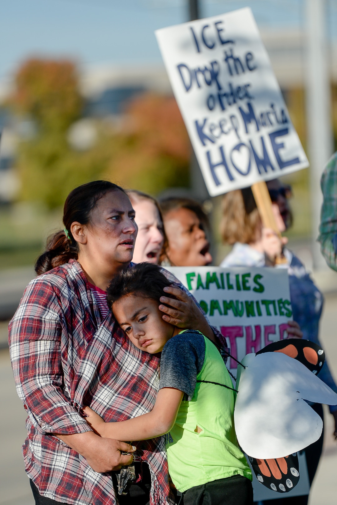 (Francisco Kjolseth  |  The Salt Lake Tribune)  Maria Santiago Garcia is embraced by her son Anthony Fajardo, 5, as community members rally in front of the Immigration and Customs Enforcement offices in West Valley City on Monday, Oct. 16, 2017, to support her. The single Utah mother of four U.S. born children faces an impending deportation order.