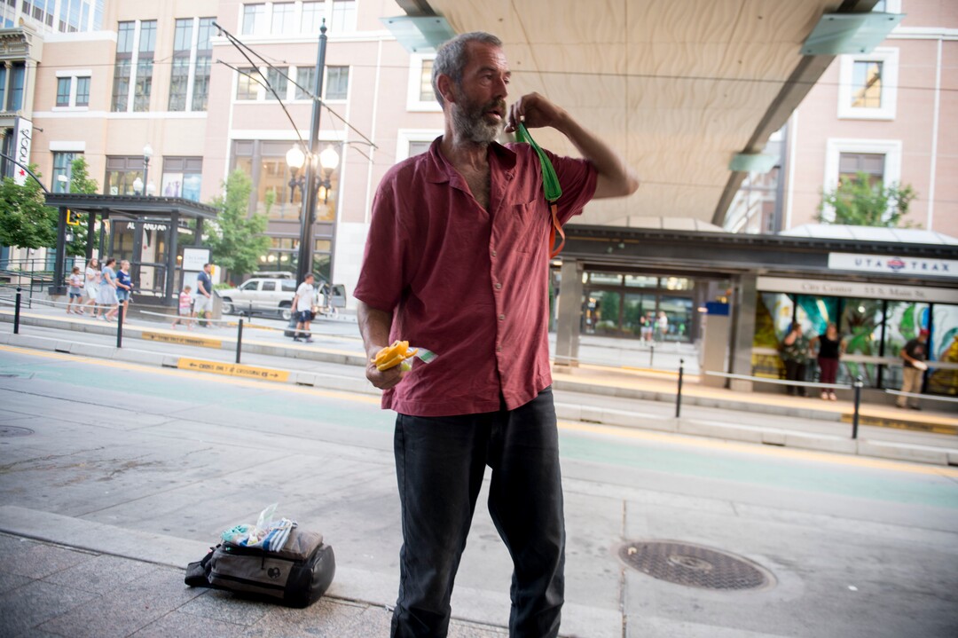 (Jeremy Harmon |  The Salt Lake Tribune) Chris Coons gathers his things as he gets ready to walk from City Creek Mall to Carl's Jr. on State Street on July 11, 2019. Both places are popular hangouts for Salt Lake City's homeless population.