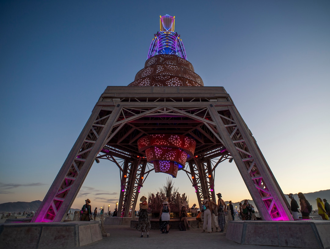 (Rick Egan  |  The Salt Lake Tribune)   The man glows as the sunsets, for the last time, before he is burned, at Burning Man, in the Black Rock Desert, near Gerlach, Nevada. The Art Theme this year is Metamorphoses. Friday, Aug. 30, 2019.
