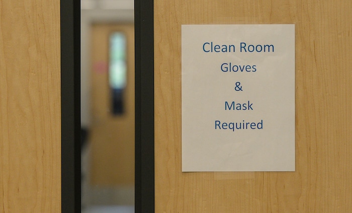 (Francisco Kjolseth | The Salt Lake Tribune) DNA Analysts work behind closed doors in an extraction clean room at the office of the medical examiner in Taylorsville where rape kits are being processed on Wed. June 6, 2018. A new tracking system provides sexual assault survivors with the ability to anonymously track the location and status of their Sexual Assault Kit from point of collection through forensic analysis. The tracking system provides real-time information to sexual assault survivors regardless of when and where their sexual assault kit was collected in the state of Utah.