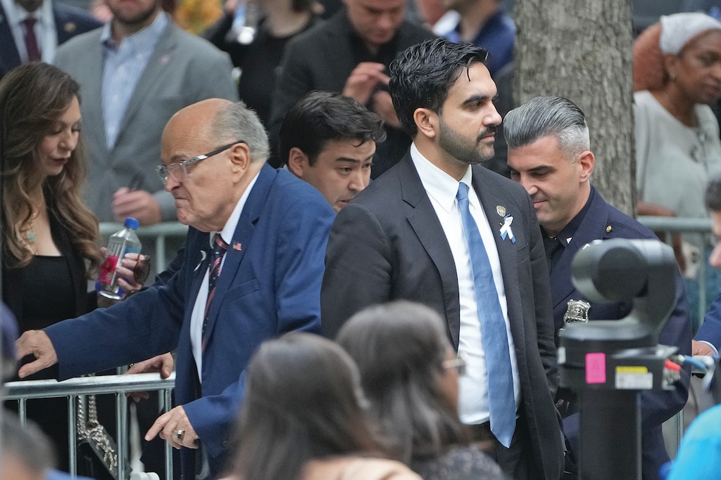 New York Mayor Zohran Mamdani, right, passes former New York Mayor Rudy Giuliani ahead of a ceremony commemorating the 25th anniversary of the Sept. 11, 2001, attacks at the National September 11 Memorial in New York City on Friday, Sept. 11, 2026. (Barry Williams /The Daily News via AP, Pool)