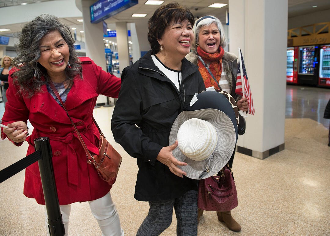 Scott Sommerdorf | The Salt Lake Tribune
Corazon Espinosa, center, walks with her sisters Celeste Galbreath, left, and Carolina Pangilinan, at right, after arriving from Australia, via Los Angeles, Thursday, March 1, 2018. Espinosa, 70, has been trying to legally immigrate to the U.S. for 40 years.