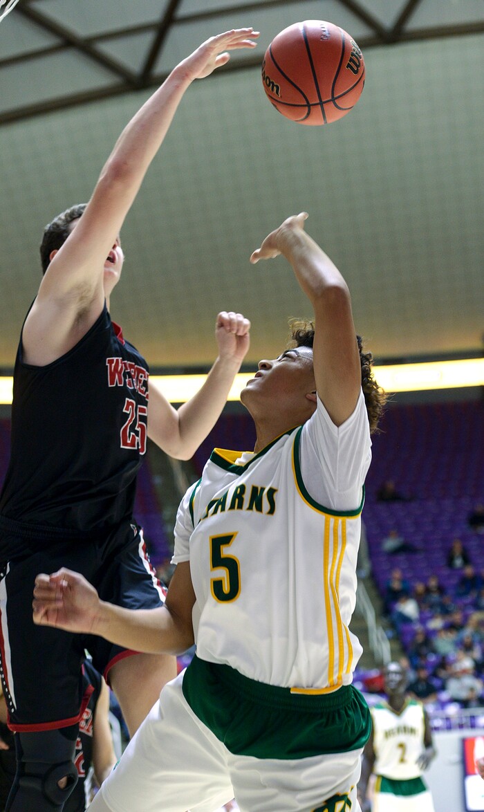 (Leah Hogsten  |  The Salt Lake Tribune) Kearns' Nate Maiava (05) is swatted by Weber's Kobe Furqueron (25). Weber defeated Kearns 60-52 in the 6A High School Boys' Basketball Tournament opening game at Weber State University’s Dee Events Center in Ogden, Tuesday, Feb. 27, 2018. 
