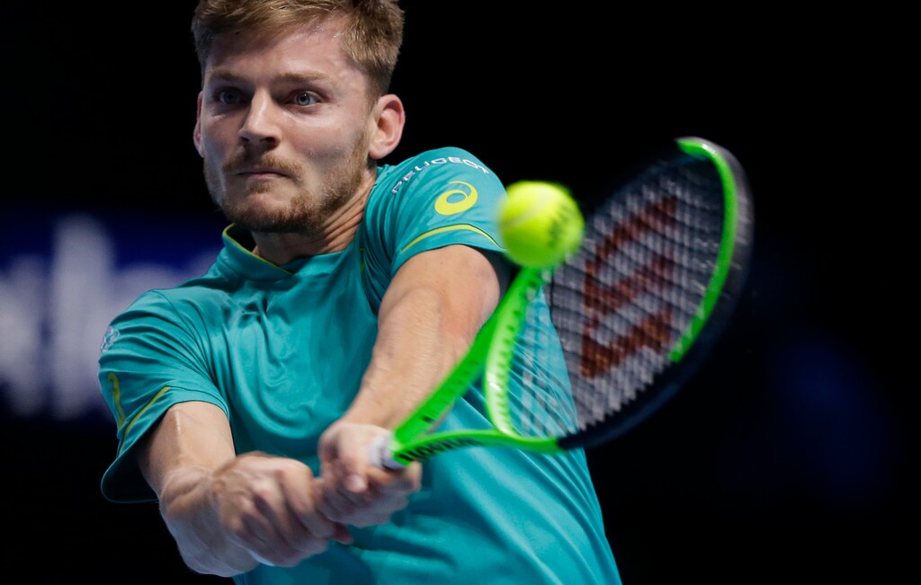 David Goffin of Belgium plays a return to Dominic Thiem of Austria during their mens singles tennis match at the ATP World Finals at the O2 Arena in London, Friday, Nov. 17, 2017. (AP Photo/Alastair Grant)