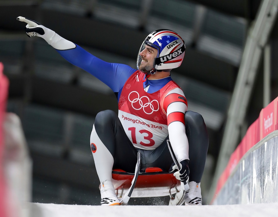 Chris Mazdzer of the U.S. brakes in the finish area Saturday after his first luge run at the 2018 Winter Olympics in Pyeongchang, South Korea. (AP Photo/Michael Sohn)