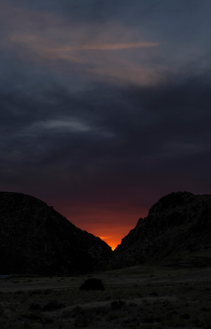 (Leah Hogsten | The Salt Lake Tribune) The sun is shown setting within the vee of the Parowan Gap, a day prior to the spring equinox observance, Saturday, Mar. 19, 2021.