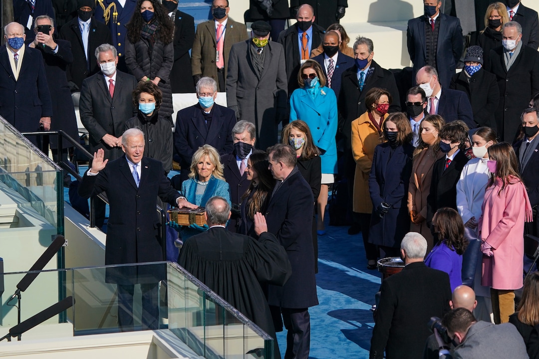 Chief Justice John Roberts swears in Joe Biden as the 46th President of the United States, as his wife Jill Biden holds a Bible at the Capitol in Washington on Wednesday, Jan. 20, 2021. (Chang W. Lee/The New York)