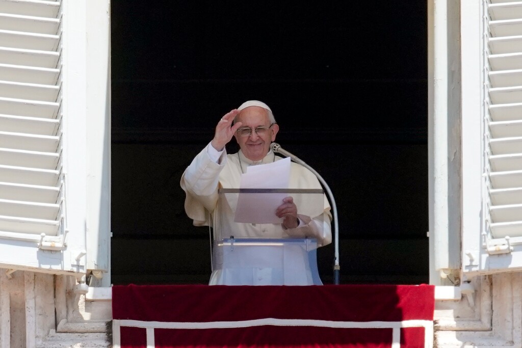 (AP Photo/Andrew Medichini) Pope Francis waves to the crowd as he recites the Angelus noon prayer from the window of his studio overlooking St. Peter's Square, at the Vatican, Sunday, June 10, 2018.