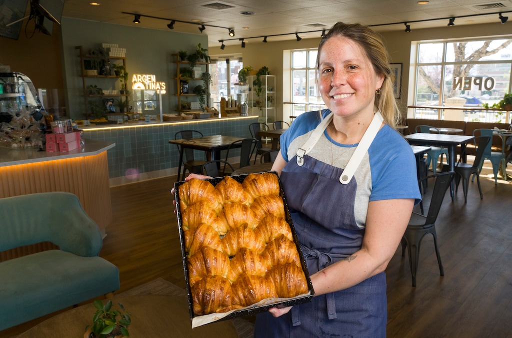 (Bethany Baker  |  The Salt Lake Tribune) Owner Valentina Udabe holds up a pan of medialunas inside Argentina's Cafe in Salt Lake City on Tuesday, March 24, 2026.
