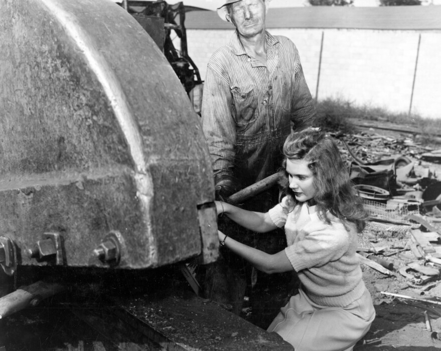 (Utah State Historical Society) A woman works with scrap metal during World War II. The Utah Minute Women helped with aid during the war effort, and they are highlighted in a story published through the Intermountain Histories project.