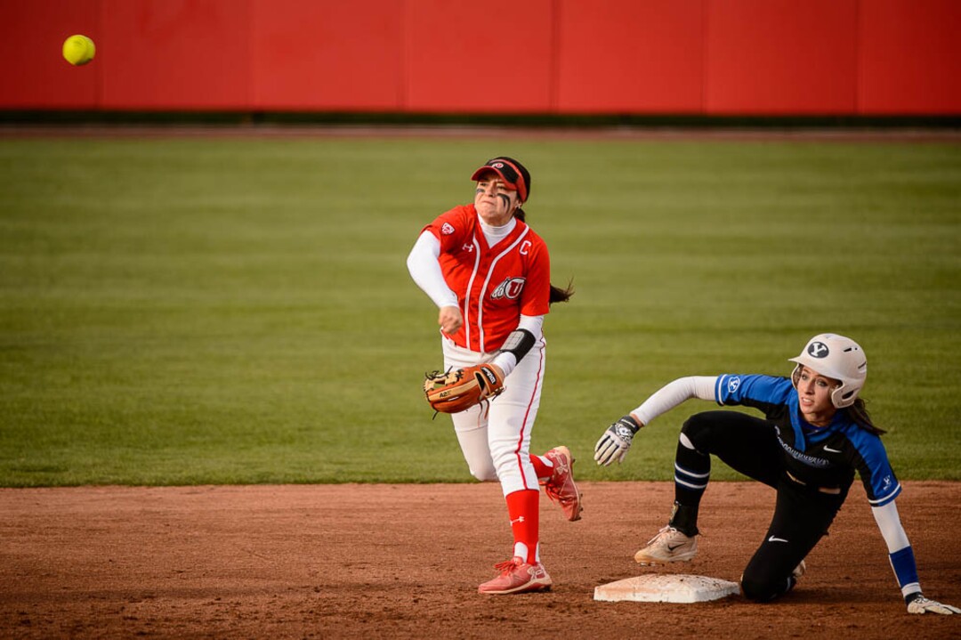 (Trent Nelson | The Salt Lake Tribune)  Utah Utes host the BYU Cougars, NCAA softball in Salt Lake City, Wednesday April 18, 2018. Utah infielder Breonna Castaneda (12) and BYU infielder Alexa Strid (16).