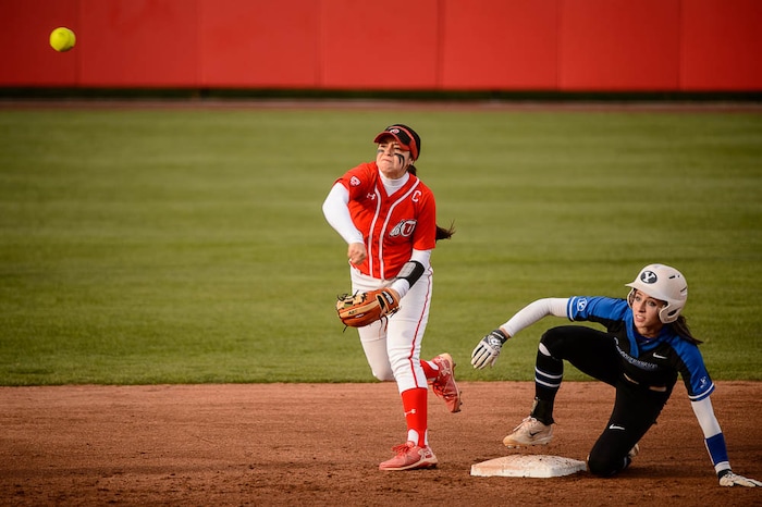 (Trent Nelson | The Salt Lake Tribune)  Utah Utes host the BYU Cougars, NCAA softball in Salt Lake City, Wednesday April 18, 2018. Utah infielder Breonna Castaneda (12) and BYU infielder Alexa Strid (16).