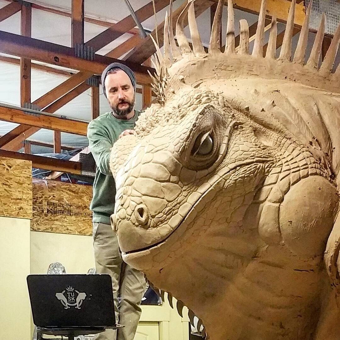 (Courtesy Red Iguana) Artist Stephen Kesler in the early stages of creating a giant iguana for the Red Iguana 2 restaurant.