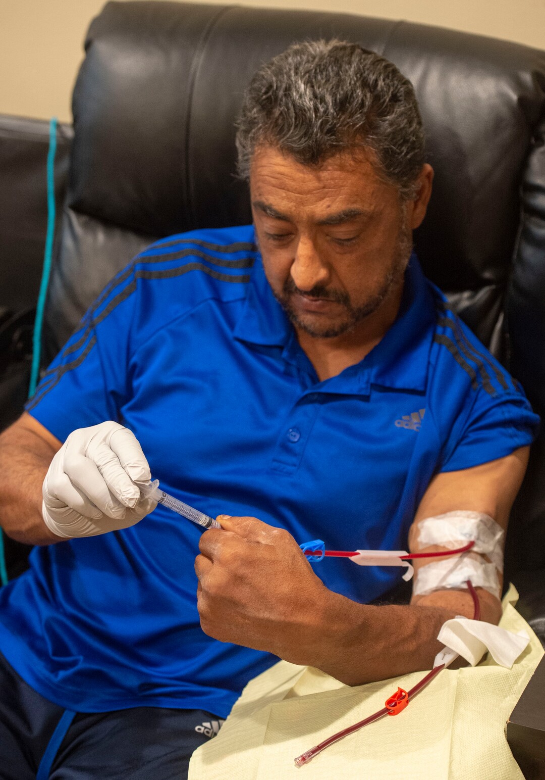 (Rick Egan  |  The Salt Lake Tribune)     Raul Gutierrez goes through the steps to setup his machine, as an in-home dialysis patient. Thursday, Sept. 5, 2019.