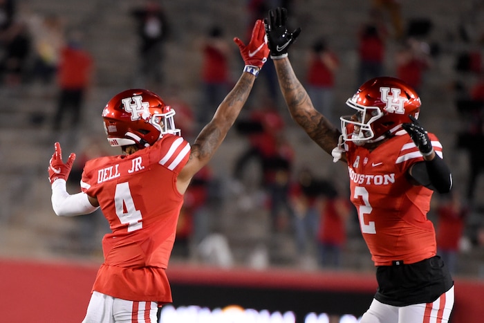 Houston wide receiver Nathaniel Dell (4) celebrates his touchdown with Deontay Anderson during the first half of an NCAA college football game against BYU, Friday, Oct. 16, 2020, in Houston. (AP Photo/Eric Christian Smith)