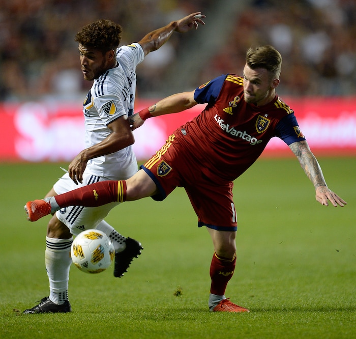 (Francisco Kjolseth  |  The Salt Lake Tribune)  Los Angeles Galaxy forward Ola Kamara (11) battles Real Salt Lake midfielder Sunday Stephen (8) during the first half of the MLS soccer match Saturday, Sept. 1, 2018, in Sandy at Rio Tinto Stadium.