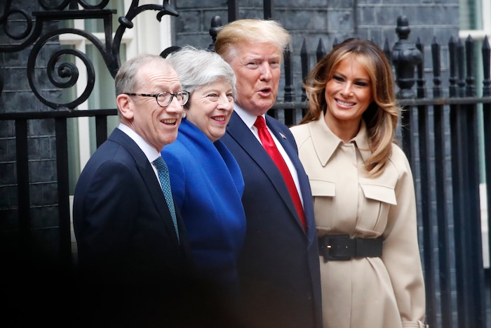 President Donald Trump and first lady Melania Trump stand for a photo with British Prime Minister Theresa May and Philip May on arrival outside of 10 Downing Street, Tuesday, June 4, 2019, in London. (AP Photo/Alex Brandon)