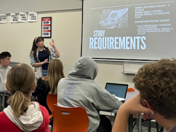 (Courtesy photo) Author Sloan Chase is editor-in-chief of Timpview High's student paper, The Thunderbolt. She is shown here leading a meeting.