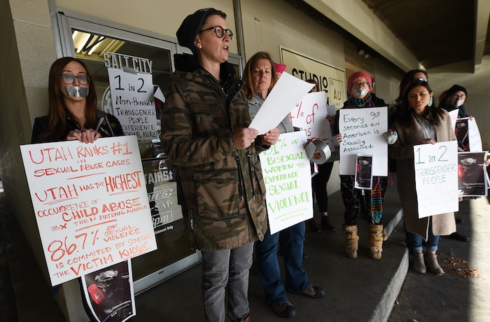 (Francisco Kjolseth | The Salt Lake Tribune) Taking a stand against the normalization of rape and sexual violence, Lesley Ann Shaw reads a letter written to Salt City Tattoo on Friday, Dec. 22, 2017, to protest following an Instagram post made by the shop's official Instagram account. The post in question was of a gift provided during the shop's white elephant exchange, a gift one of the artists at the parlor called a "rape kit," containing leather gloves, black duct tape, a bottle of lubricant, rope, and a knife.