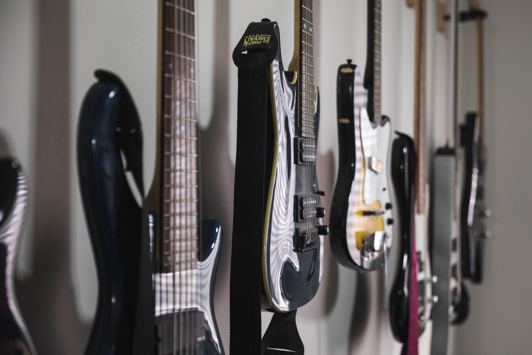 (Clark Clifford  |  For The Salt Lake Tribune) Guitars hanging in the Noble Bodies rehearsal space in Orem on Saturday, Aug. 3, 2019.