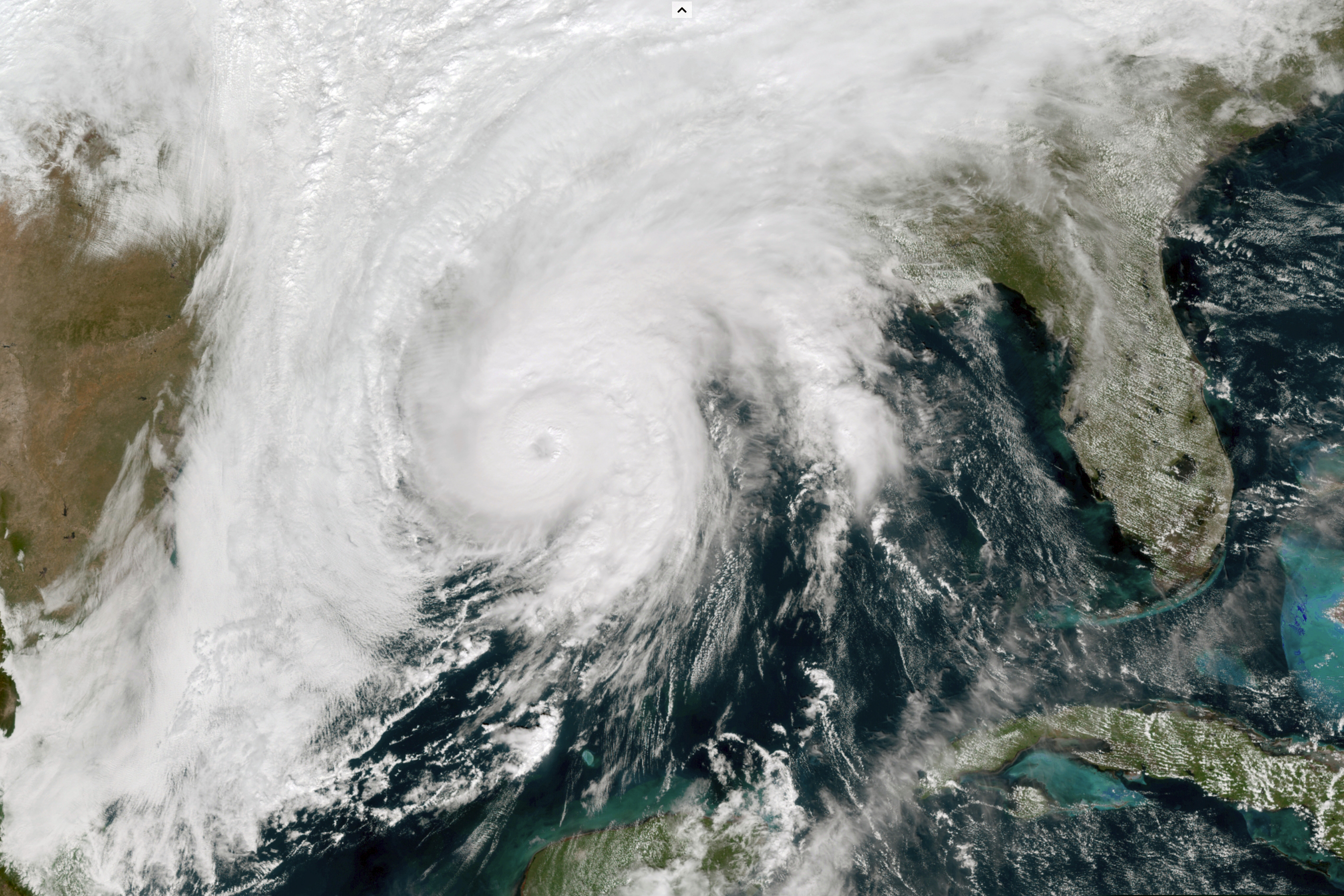 This GOES-16 GeoColor satellite image taken, Wednesday, Oct. 28, 2020, at 1 p.m. EDT, and provided by NOAA, shows Hurricane Zeta in the Gulf of Mexico nearing Louisiana.  (NOAA via AP)