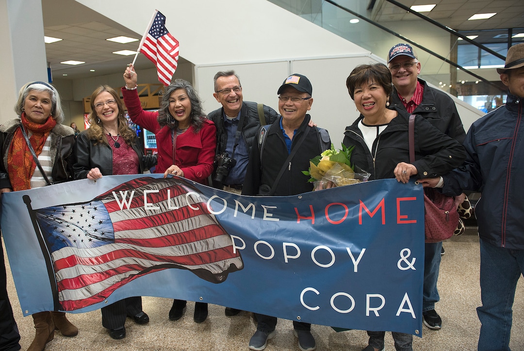 Scott Sommerdorf | The Salt Lake Tribune
Corazon Espinosa, right, poses for a photo with her sisters and their families, holding a banner they had made for her arrival, Thursday, March 1, 2018. Espinosa has been trying to legally immigrate to the U.S. for 40 years.