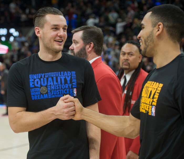 (Rick Egan  |  The Salt Lake Tribune)    Dallas Mavericks guard Kyle Collinsworth (8) greets Utah Jazz guard Naz Mitrou-Long (30) after the game between Utah Jazz and Dallas Mavericks in Salt Lake City, Saturday, Feb. 24, 2018.