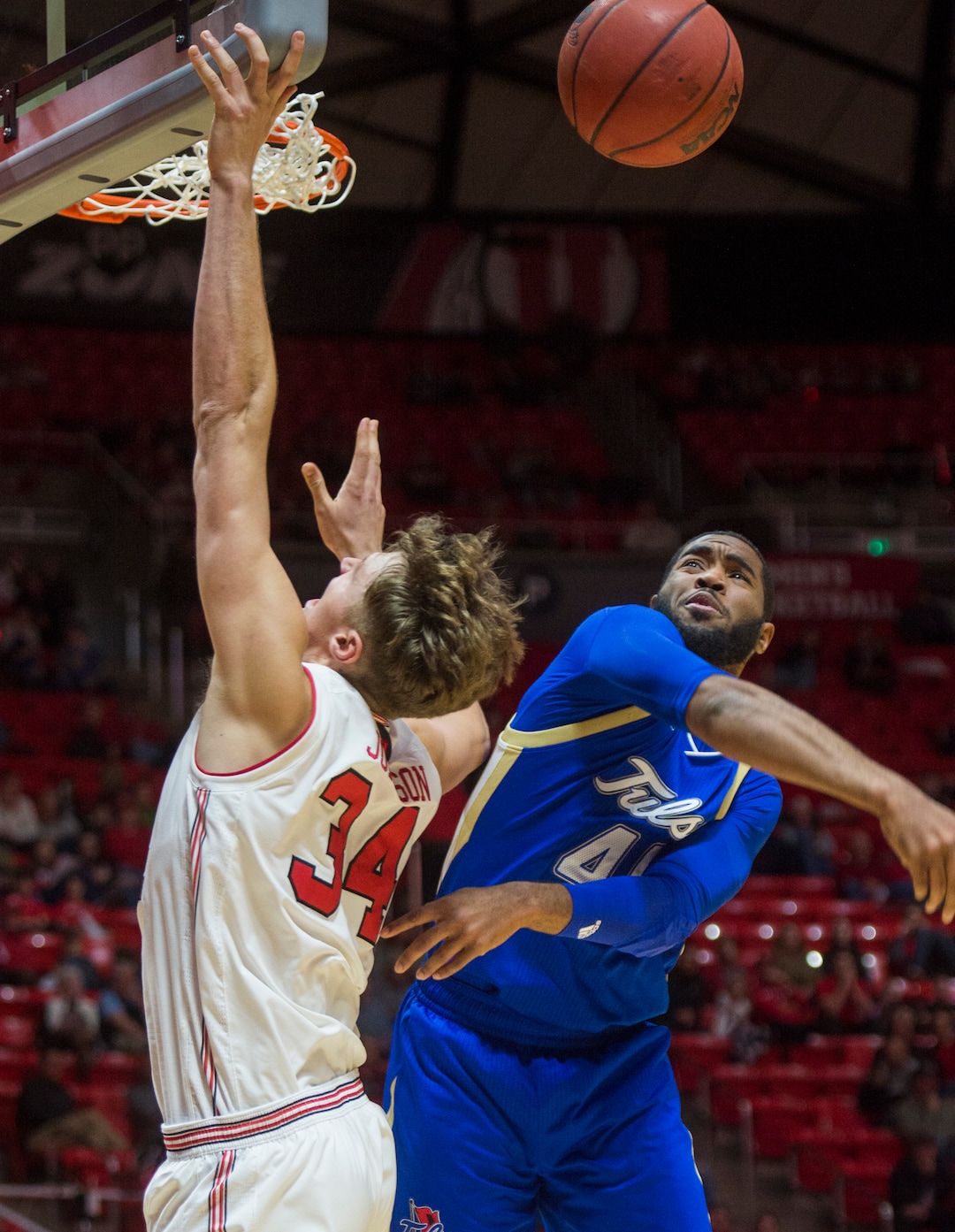 (Rick Egan  |  The Salt Lake Tribune)   Tulsa Golden Hurricane forward Jeriah Horne (41) blocks a sho by Utah Utes center Jayce Johnson (34), in basketball action between, Utah Utes and Tulsa Golden Hurricane, at the Jon M. Huntsman Center, Saturday, Dec. 1, 2018.