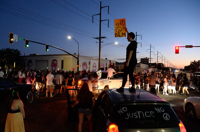 (Francisco Kjolseth  |  The Salt Lake Tribune) Protesters march the streets of downtown Salt Lake City as they congregate at 800 South, 300 West by the mural of George Floyd and other people killed in Utah by police as they rally against police brutality on Friday, June 26, 2020.