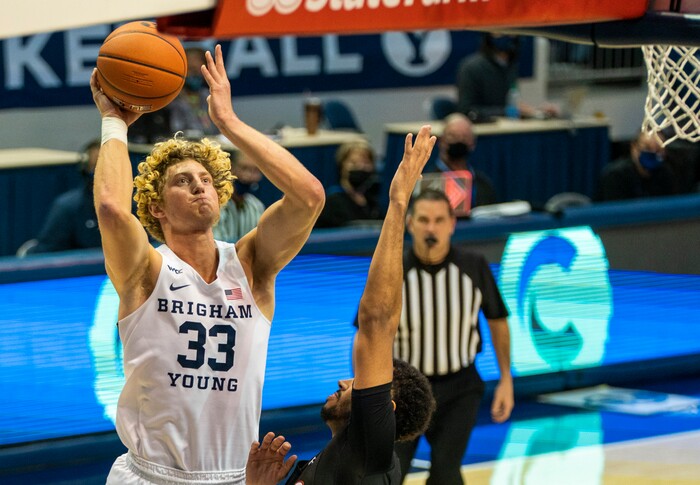 (Rick Egan | The Salt Lake Tribune)  Brigham Young Cougars forward Caleb Lohner (33) shoots as Pacific Tigers forward Jeremiah Bailey (13) defends, in basketball action, between the Brigham Young Cougars and the Pacific Tigers, at the Marriott Center in Provo, on Saturday, Jan. 30, 2021.