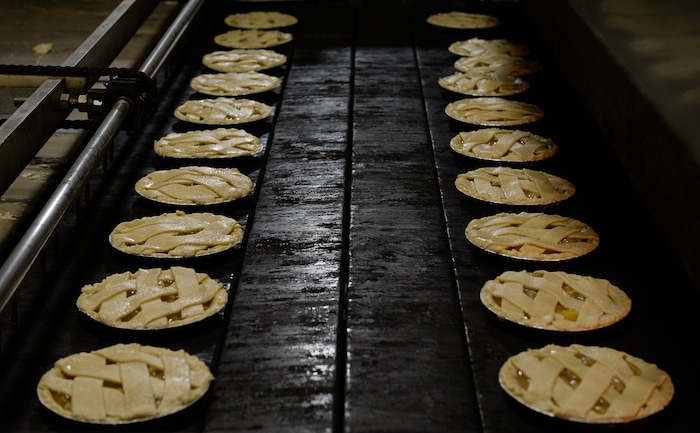 Francisco Kjolseth | The Salt Lake Tribune
Hand laid lattice apple pie enter the ovens at Rocky Mountain Pie factory in Salt Lake recently. Eight different pies sold through Associated Food Stores earned blue ribbons in the commercial categories at the National Pie Championships.