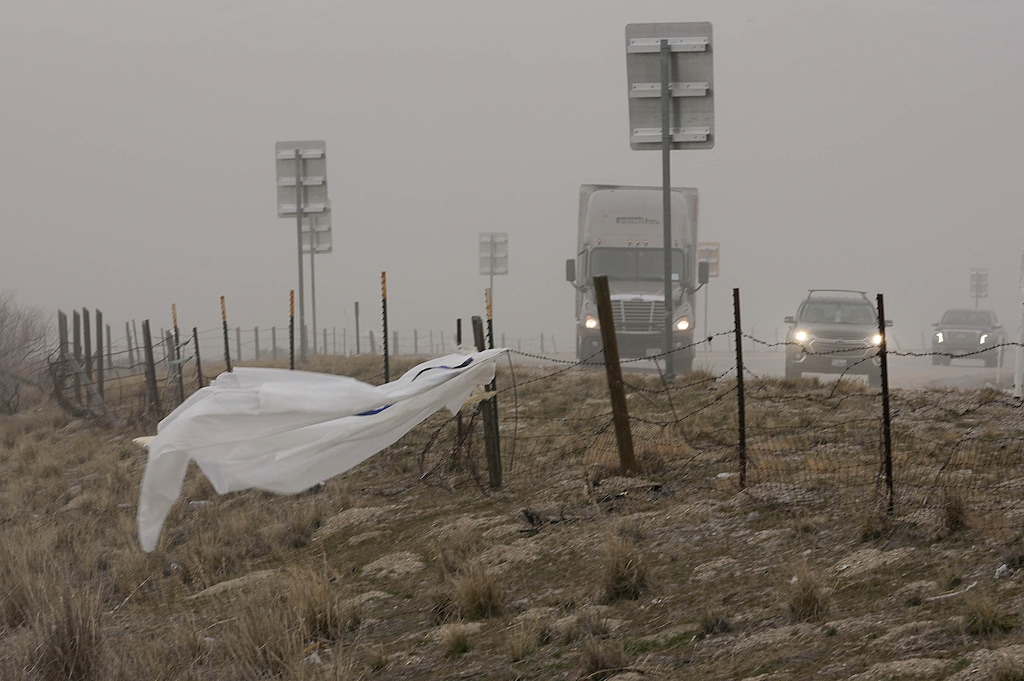 (Francisco Kjolseth | The Salt Lake Tribune) Strong winds blow dust across Interstate 80 near the south shore of the Great Salt Lake on Wednesday, March 29, 2023. High winds expected in Utah on Thursday and Friday could make travel difficult for high-profile vehicles.