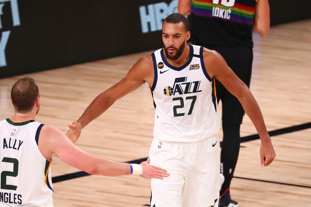 (Kim Klement | Pool via AP) Utah Jazz center Rudy Gobert (27) celebrates with guard Joe Ingles (2) after being fouled while making a basket against the Denver Nuggets in Game 2 of an NBA basketball first-round playoff series, Wednesday, Aug. 19, 2020, in Lake Buena Vista, Fla.