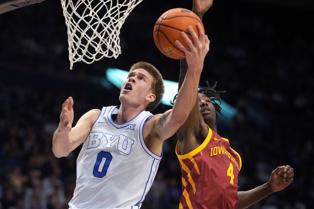 (George Frey | AP) BYU forward Noah Waterman (0) lays the ball in past Iowa State guard Demarion Watson (4) during the second half of an NCAA college basketball game Tuesday, Jan. 16, 2024, in Provo.