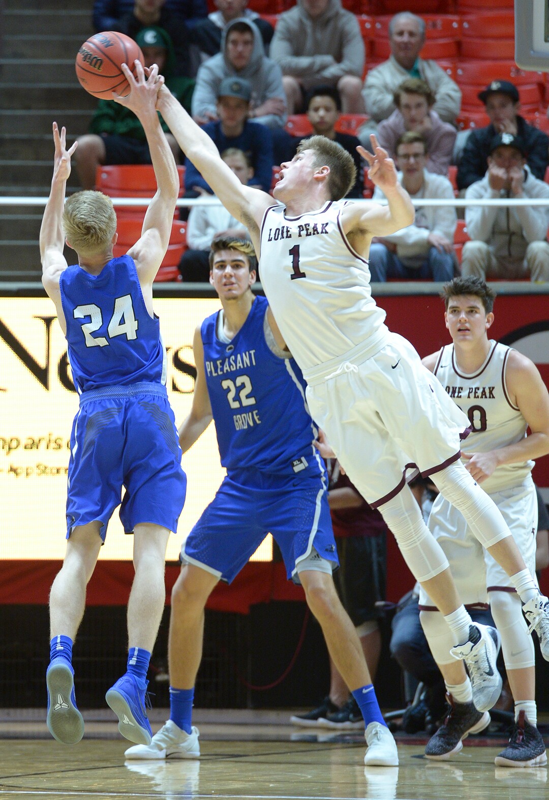 (Leah Hogsten  |  The Salt Lake Tribune) Lone Peak's Max Brenchley (01) tries to stop Pleasant Grove's Kael Mikkelsen (24). Pleasant Grove plays Lone Peak to win the 6A High School BoysÕ Basketball Tournament Championship at the Jon M. Huntsman Center in Salt Lake City, Saturday, March 3, 2018. 