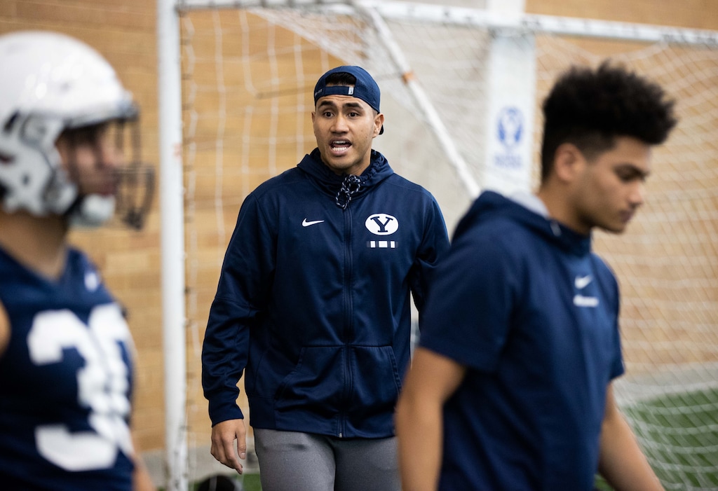 (Photo courtesy of Jaren Wilkey | BYU Athletics) New BYU running backs coach Harvey Unga puts his players through their paces at a recent BYU football spring practice.