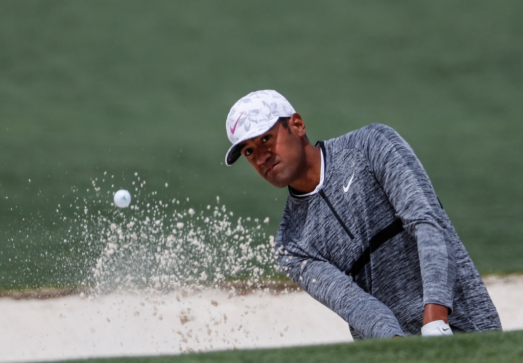 (AP Photo/David Goldman) Tony Finau hits from a bunker on the second hole during the fourth round at the Masters golf tournament Sunday, April 8, 2018, in Augusta, Ga.
