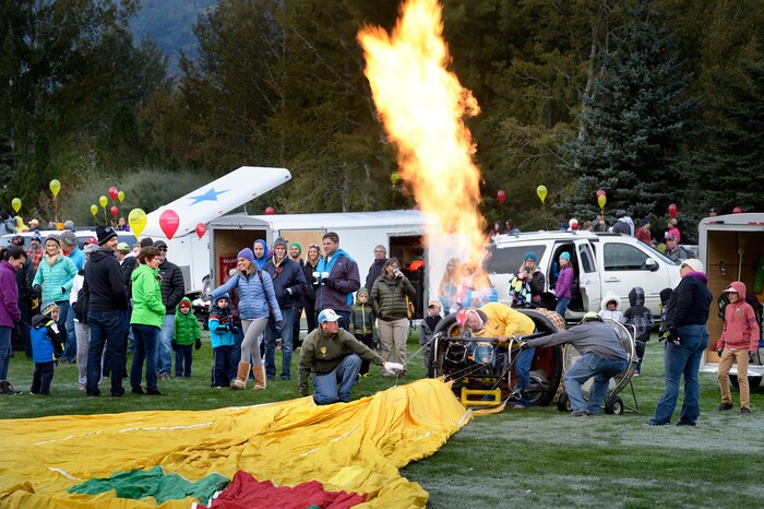 (Scott Sommerdorf | The Salt Lake Tribune)
Balloon crews begin to inflate the gallons prior to launch at the 4th annual Autumn Aloft Hot Air Balloon Festival in Park City, Sunday, September 17, 2017.