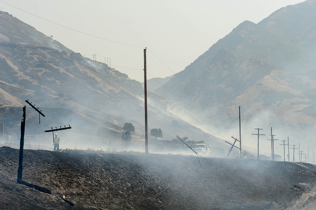 (Trent Nelson | The Salt Lake Tribune)  Power lines along the train tracks after a fire came through at the mouth of Weber Canyon, Tuesday September 5, 2017.