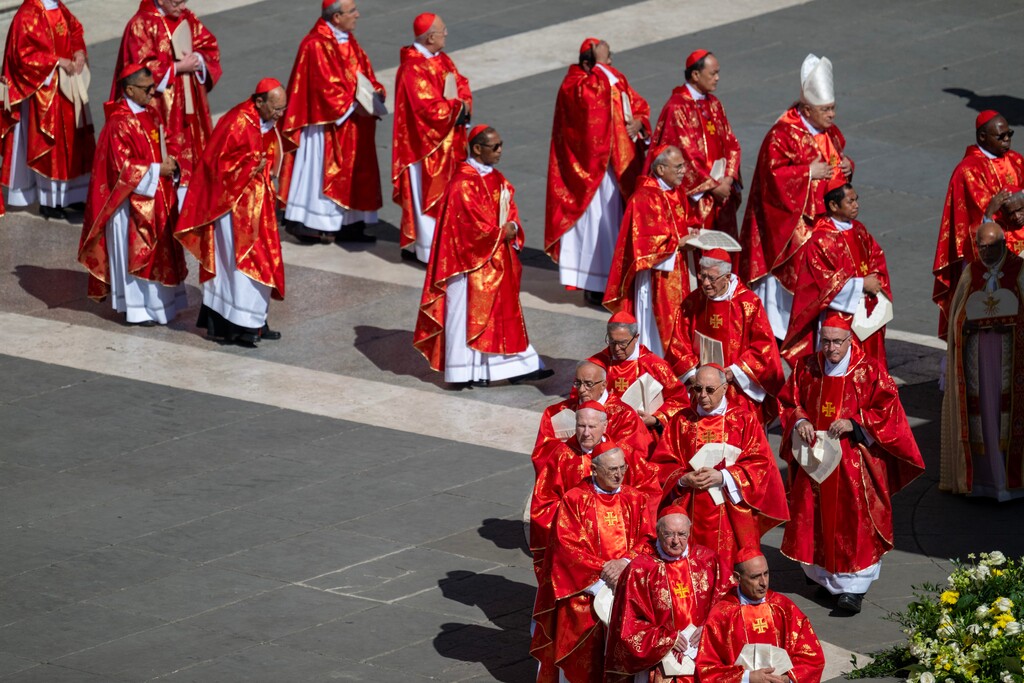 (James Hill | The New York Times) Cardinals enter St. Peter's Square in Vatican City for the funeral of Pope Francis on Saturday, April 26, 2025.