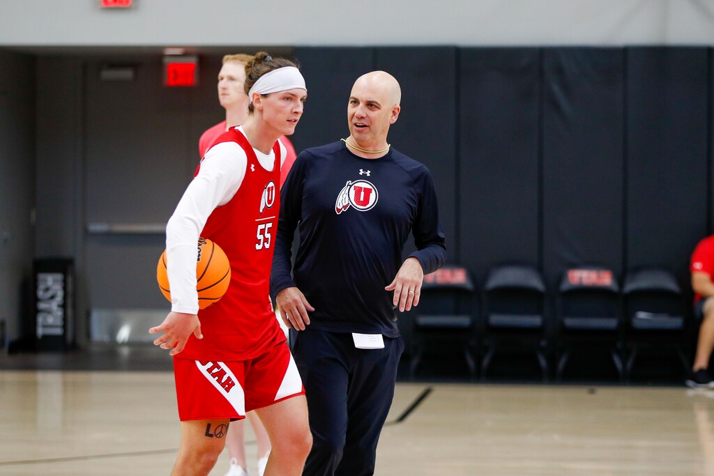 (Utah Athletics) University of Utah basketball coach Craig Smith instructs freshman forward Gabe Madsen during a recent practice.