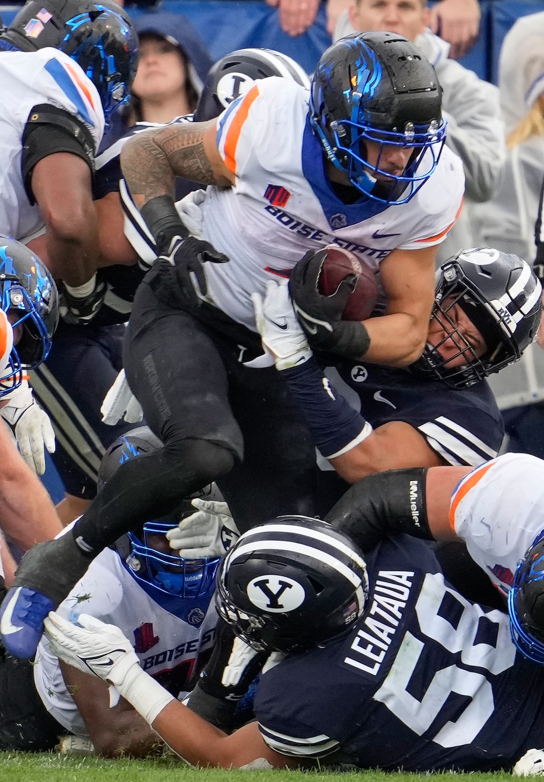 (Leah Hogsten | The Salt Lake Tribune) Boise State Broncos running back Cyrus Habibi-Likio (4) fight for more yards as No. 10 Brigham Young University hosts Boise State at LaVell Edwards Stadium, Oct. 9, 2021.