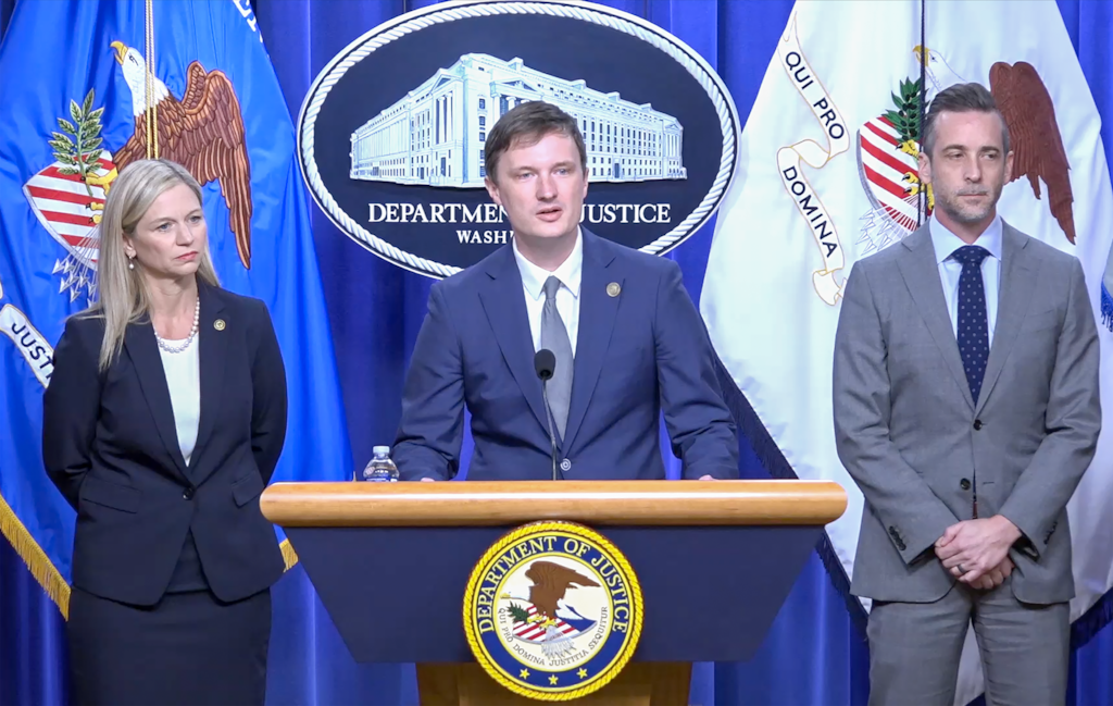 (U.S. Department of Justice) Acting Deputy Attorney General Trent McCotter speaks during a news conference in Washington, Tuesday, Sept. 22, 2026, announcing charges against a Utah postal worker accused of destroying ballots before they were mailed to voters during the June primary election.