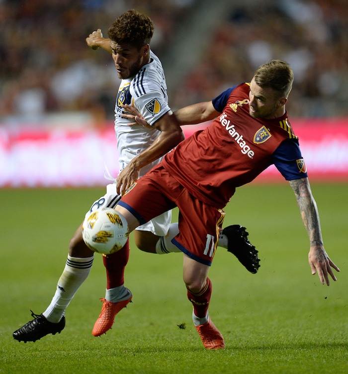 (Francisco Kjolseth  |  The Salt Lake Tribune)  Los Angeles Galaxy forward Ola Kamara (11) battles Real Salt Lake midfielder Sunday Stephen (8) during the first half of the MLS soccer match Saturday, Sept. 1, 2018, in Sandy at Rio Tinto Stadium.