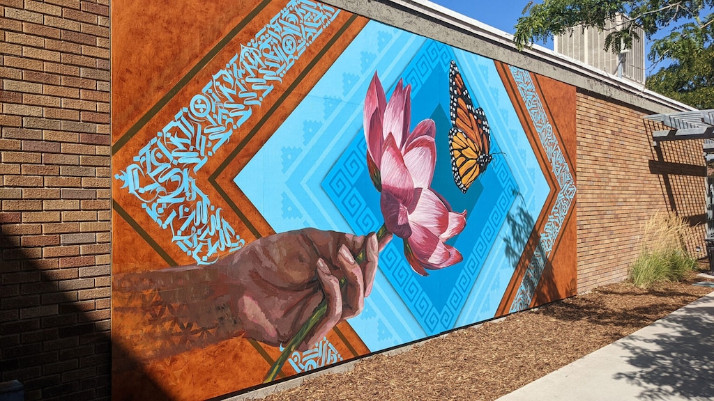 (Jonny Tollestrup | Globeslcc.com) Luis Novoa, Alan Ochoa and Miguel Galaz — known together as Roots Art Kollective — completed a mural for the new Peace and Justice Garden at Salt Lake Community College's South City Campus. The artists are all SLCC alumni.