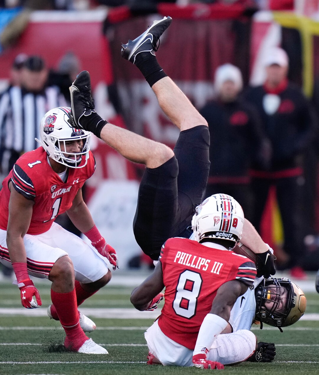(Francisco Kjolseth | The Salt Lake Tribune) Colorado Buffaloes tight end Brady Russell (38) gets upended by Utah Utes cornerback Clark Phillips III as the University of Utah hosts the Colorado Buffaloes in Pac-12 football, Friday, Nov. 26, 2021 at Rice-Eccles Stadium.