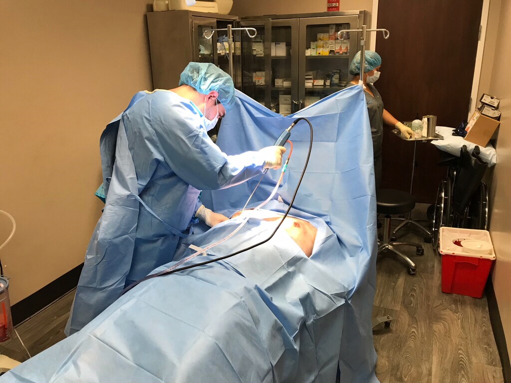 (Eric Pianin | The Washington Post) Marwan Khalifeh performs a breast-reduction procedure on a male patient. More than 27,000 American men opted for this treatment in 2016.