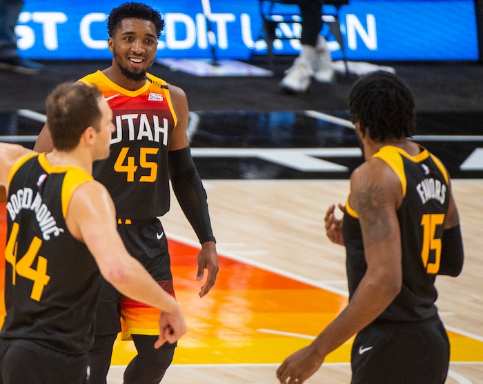 (Rick Egan | The Salt Lake Tribune) Utah Jazz guard Donovan Mitchell (45) forward Bojan Bogdanovic (44) Jazz center Derrick Favors (15), react as the Jazz extend their lead, in NBA action between the Utah Jazz and the Atlanta Hawks at Vivint Arena, on Friday, Jan. 15, 2021.