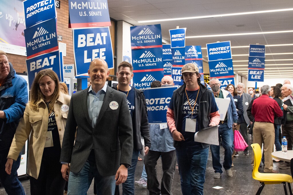 (Briana Scroggins | Special to The Tribune) Utah independent Evan McMullin walks with supporters to the auditorium during the Utah Democratic Convention at Cottonwood High School in Murray, Utah on Saturday, April 23, 2022.